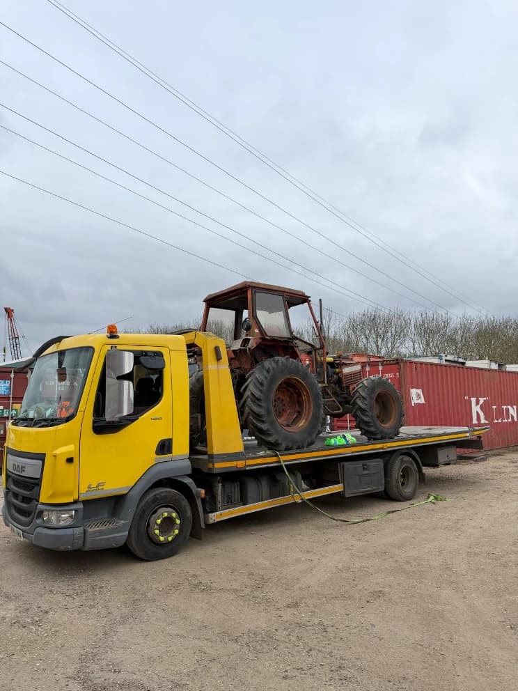Tractor secured for transport by AHS Recovery